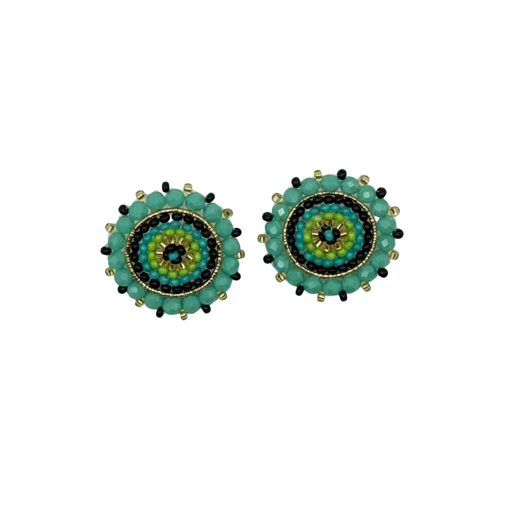 A pair of handmade beaded circular earrings with concentric mandala patterns in turquoise, green, yellow, black, and gold, displayed on a plain white background.