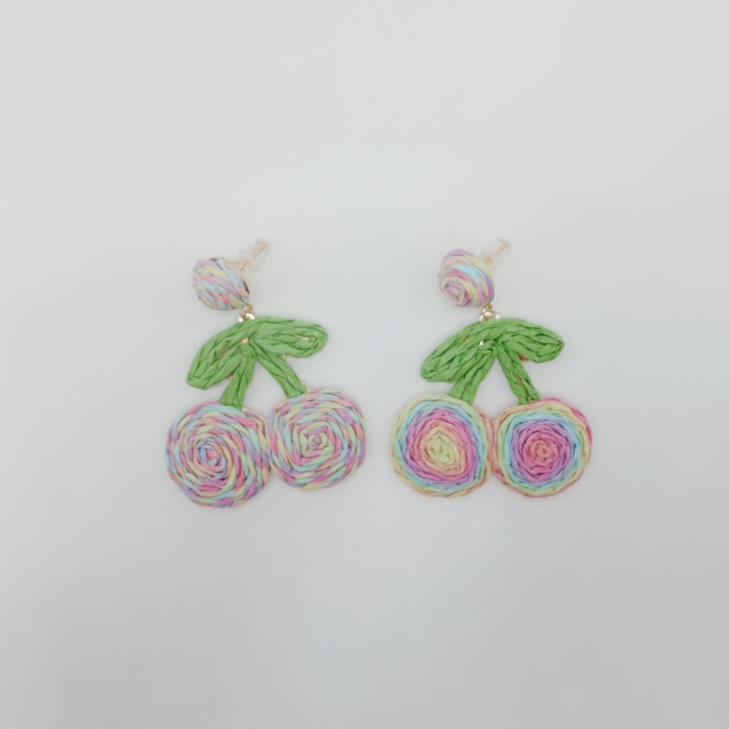 Pair of earrings with floral design on a white background