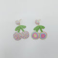 Pair of earrings with floral design on a white background