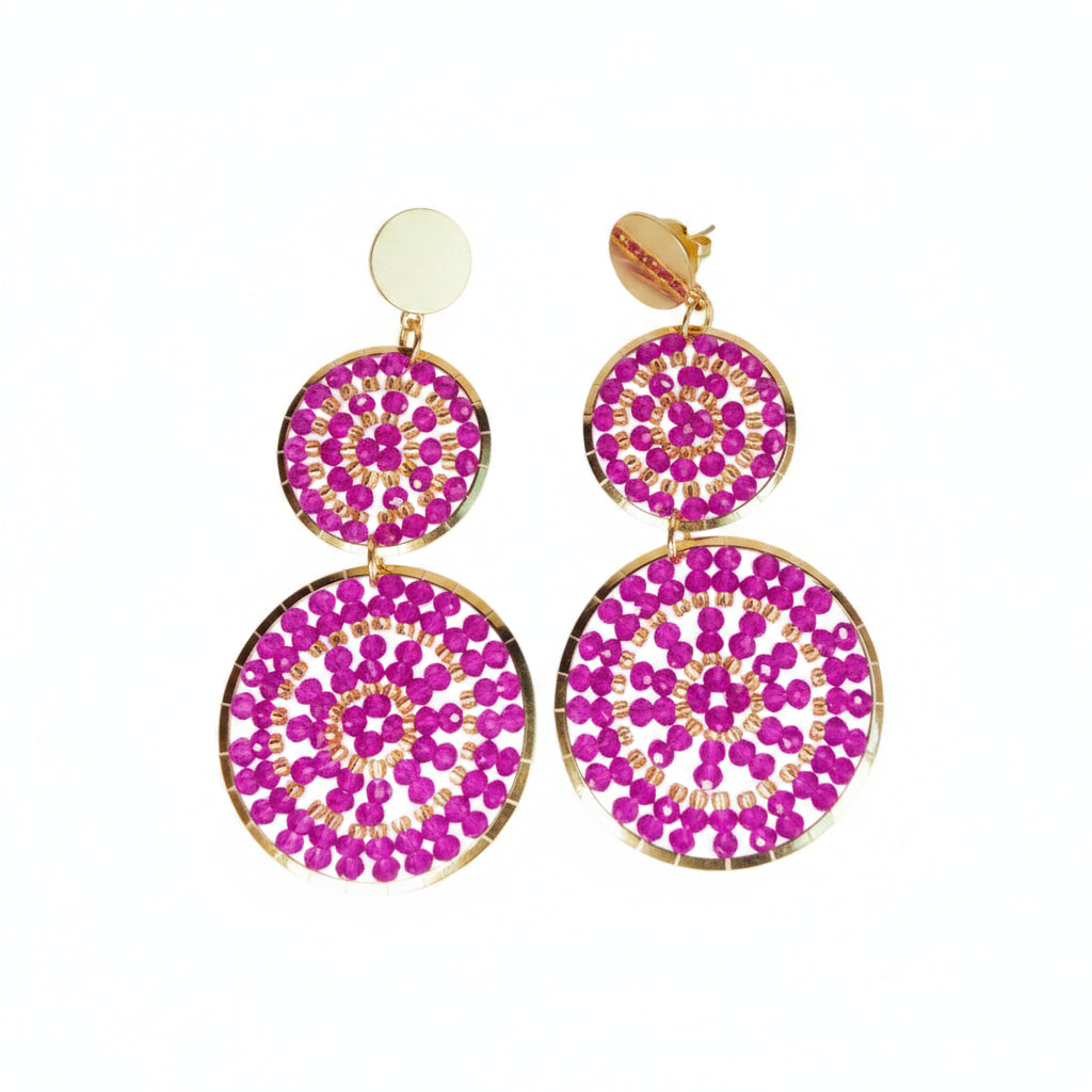 Pair of pink circular earrings with gold accents