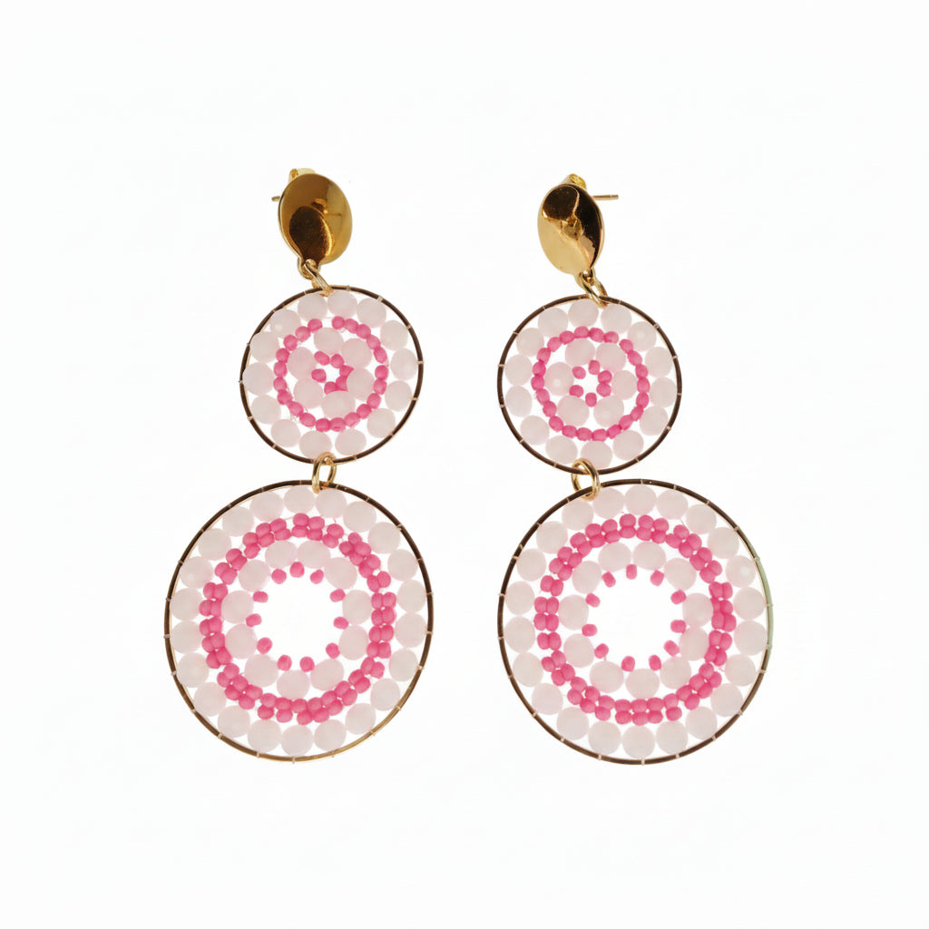 Pair of earrings with pink circular designs 