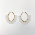 Gold hoop earrings with white beaded accents