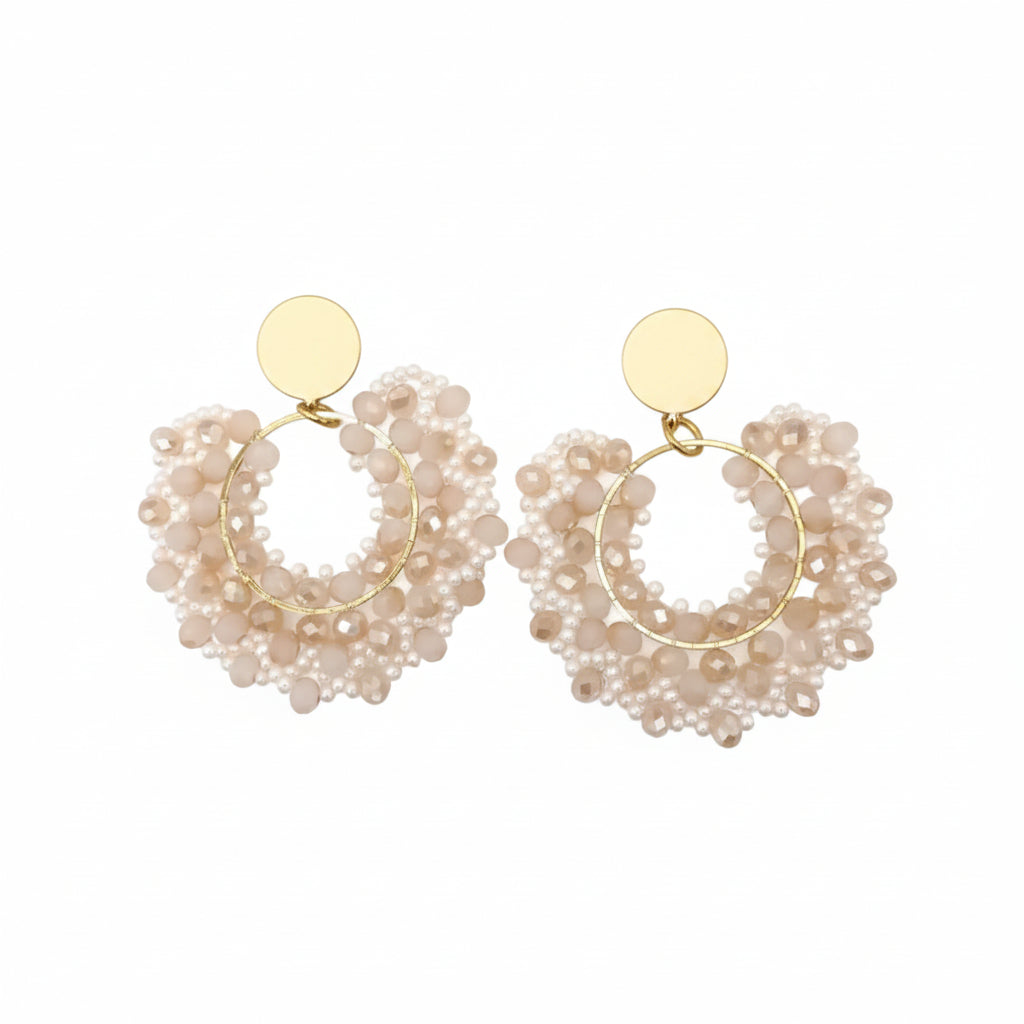 Pair of gold hoop earrings with pearl-like beads 