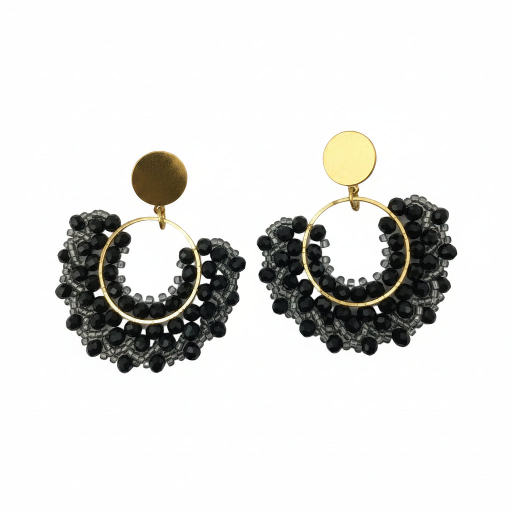 Pair of gold hoop earrings with black beads