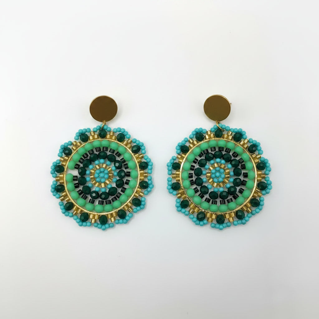 Pair of earrings with green and blue circular design