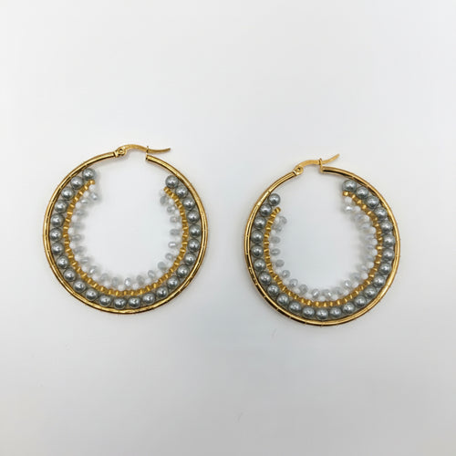 Pair of gold hoop earrings with small stones