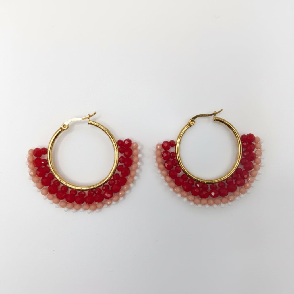 Gold hoop earrings with red beads