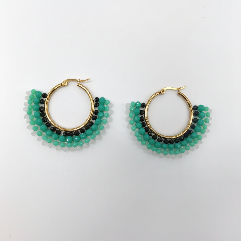 Pair of hoop earrings with green and black beads