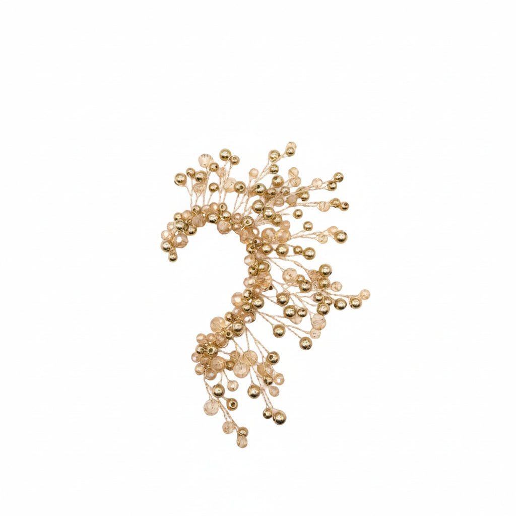 Gold beads arranged in a decorative pattern 
