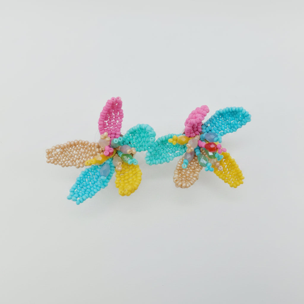Colorful beaded earrings on a white background
