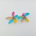 Colorful beaded earrings on a white background