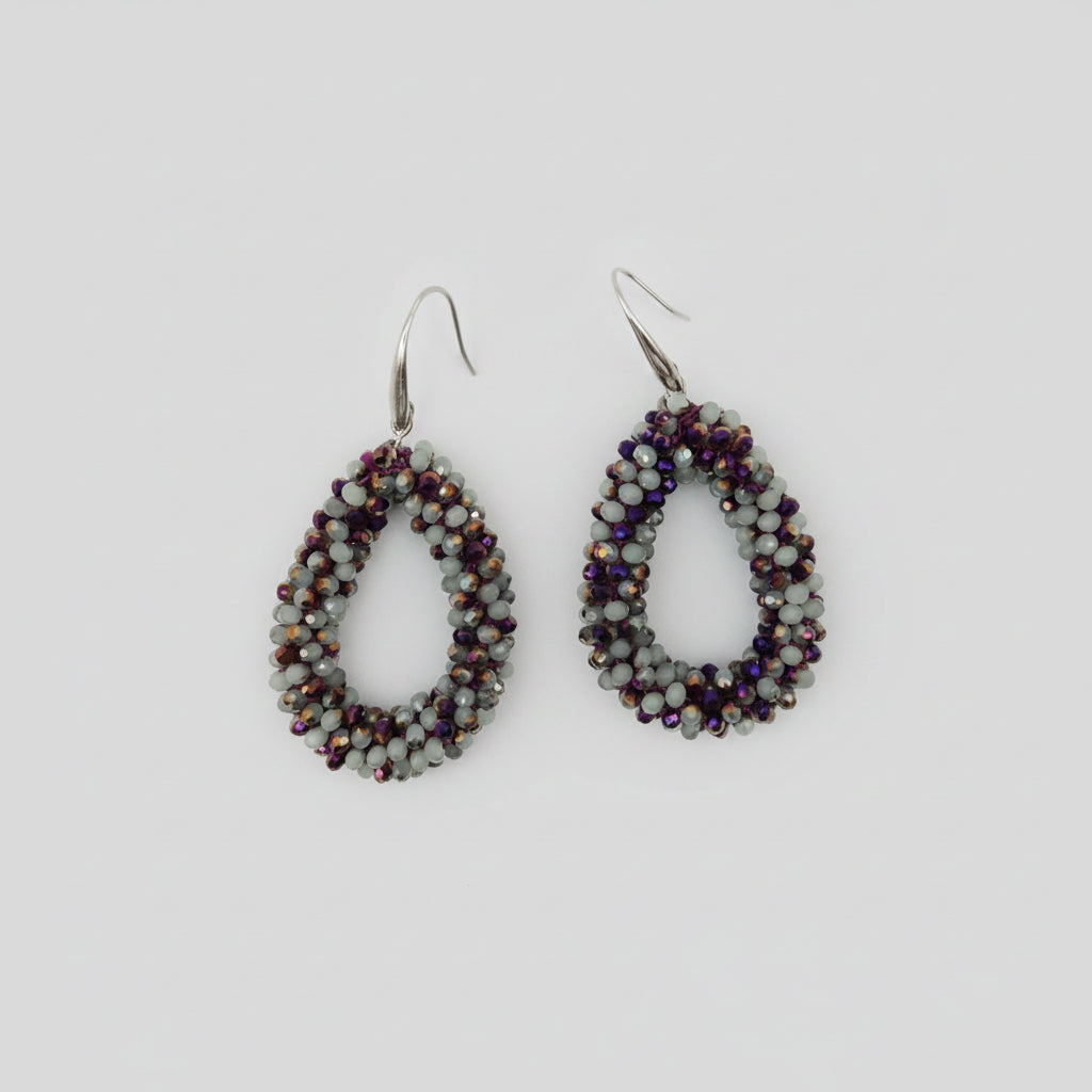 Pair of beaded earrings on a white background