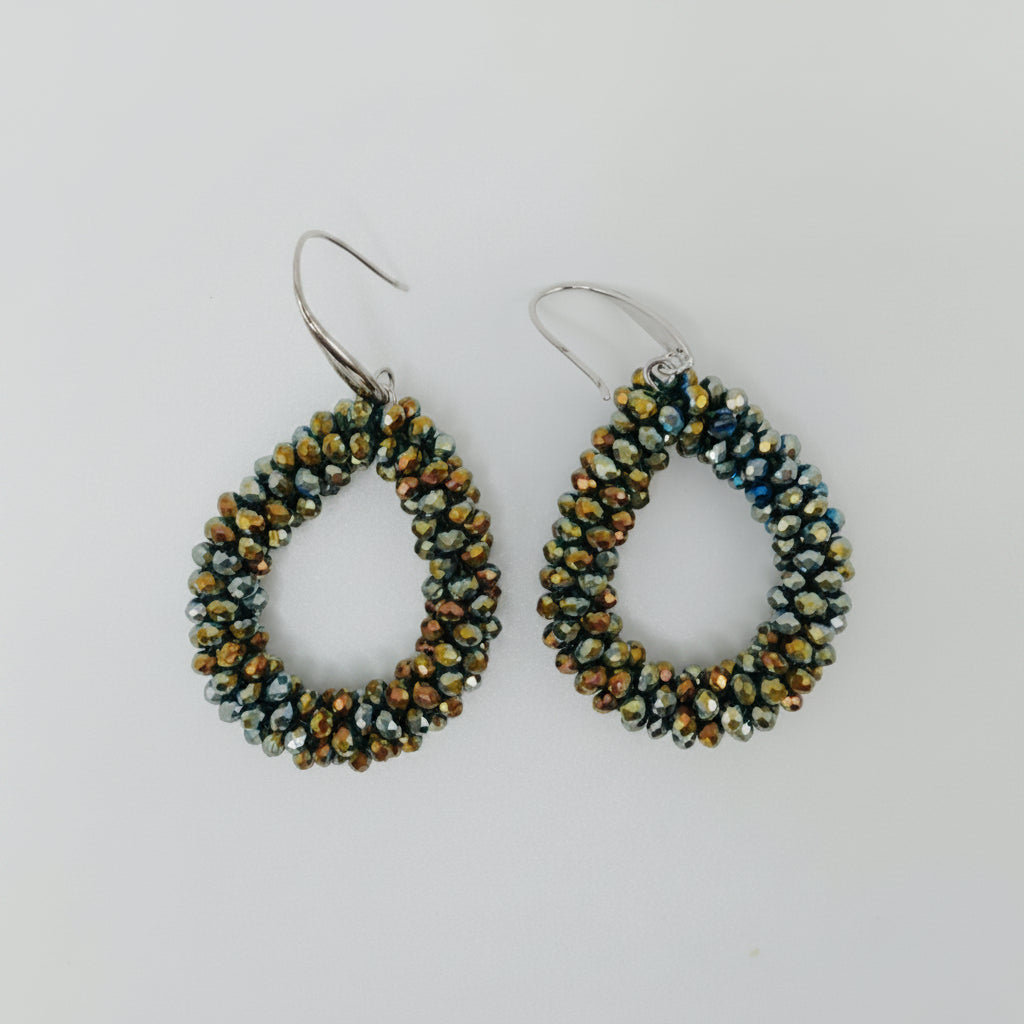 Pair of beaded earrings on a light gray background