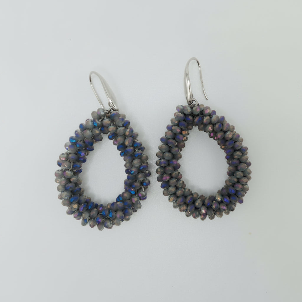 Pair of beaded earrings on a light gray background