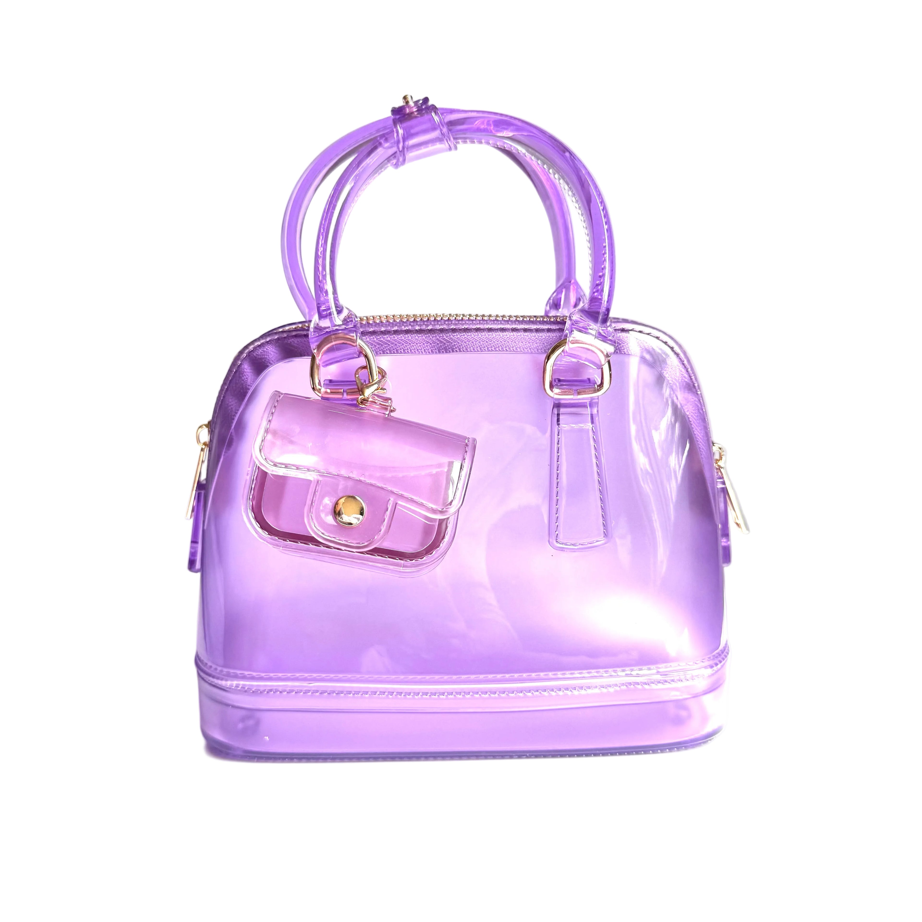 Purple transparent handbag with gold accents on a white surface
