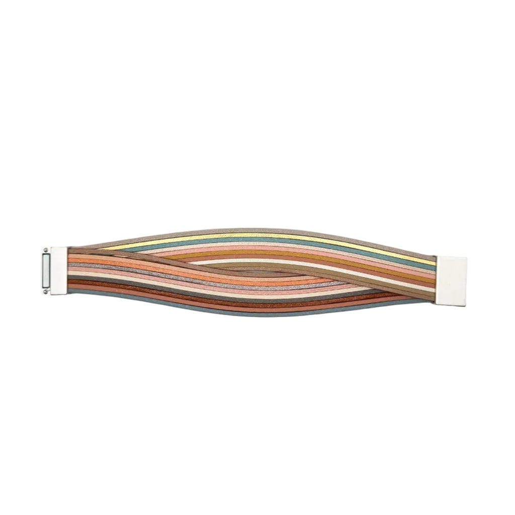 A multi-colored flat ribbon cable with a wavy, undulating shape, featuring a white connector on each end, photographed on a plain light gray background.