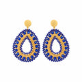 A pair of teardrop-shaped beaded earrings with gold studs, featuring a blue and gold patterned design, displayed on a white background.