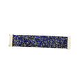 A wide fabric bracelet featuring a dense, textured mosaic pattern of blue, black, gray, and gold flecks, finished with white elastic end bands.