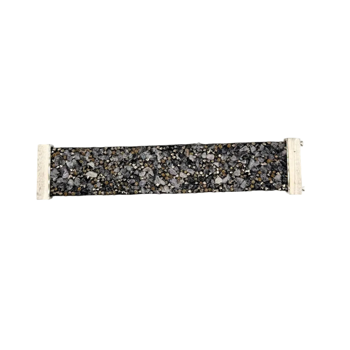 A fabric wristband or bracelet featuring a black and gray speckled terrazzo pattern with white elastic end loops, shown against a plain light gray background.