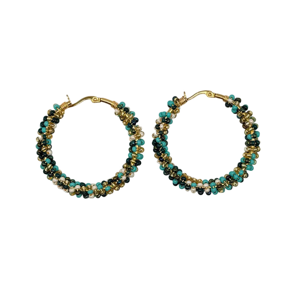 A pair of gold-tone hoop earrings adorned with multiple strands of small beads in turquoise, black, and gold, displayed on a clean white background.