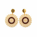 A pair of handmade beaded earrings with gold-toned circular studs and textured gold and brown circular drop charms, displayed on a white card hanger against a white background.