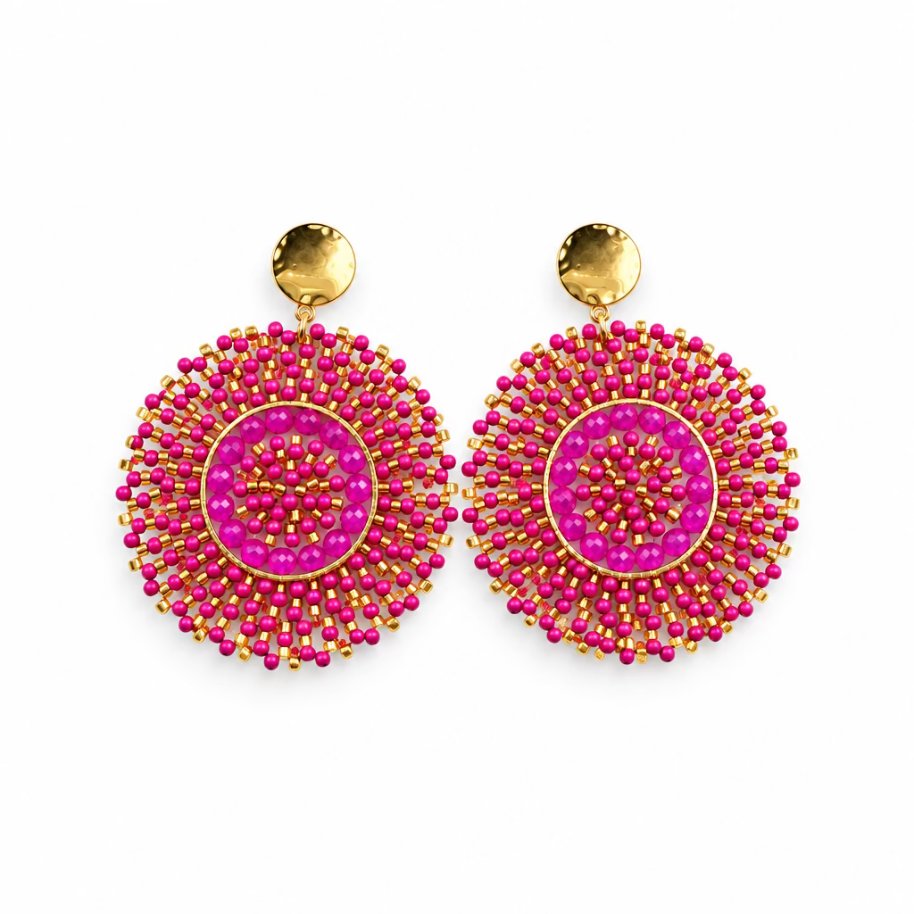 A pair of handmade circular dangle earrings in magenta pink and gold, displayed on a white card labeled 'STAINLESS STEEL'.