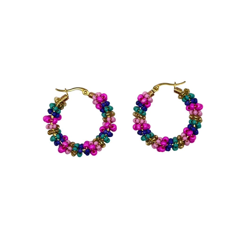 A pair of small gold-tone hoop earrings decorated with tightly woven strands of pink, teal, and blue seed beads, displayed on a clean white background.
