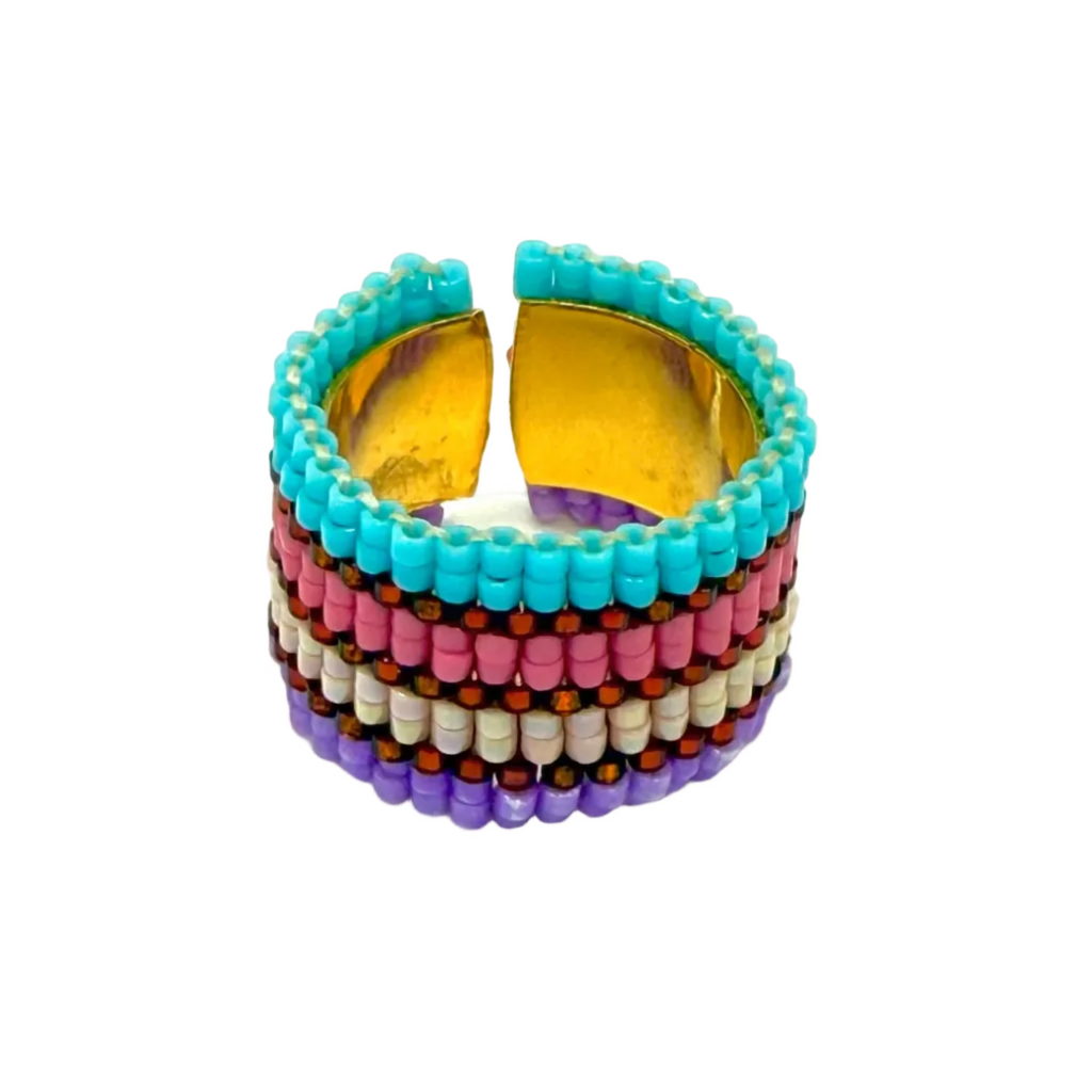 Multicolored beaded ring on a light gray background
